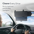 Car interior with a sunshade blocking harsh sun and blinding headlights, with text 'Clearer Every Drive' and 'SALE' label.